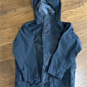 The North Face Boy’s Hyvent Black Hooded Raincoat with Subtle Pattern Panels